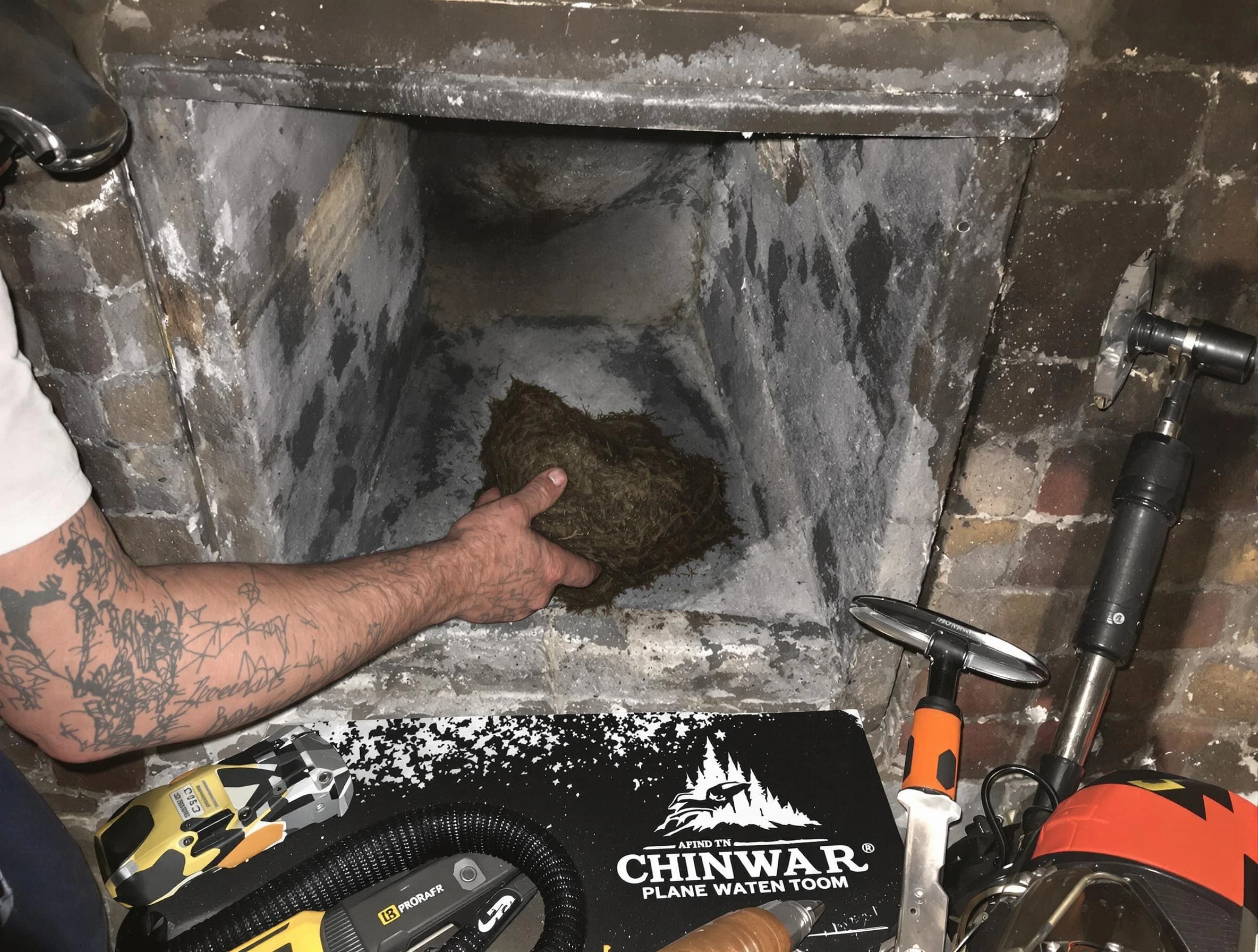 Littleton Chimney Sweep safely removing debris and screening chimney in Littleton, CO